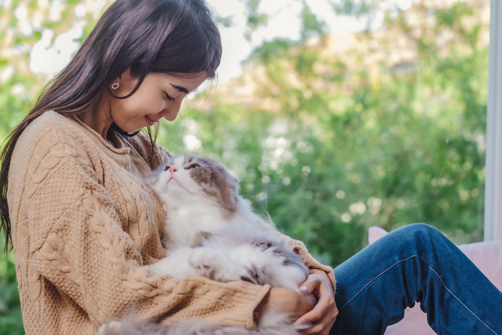 Woman and her cat sitting